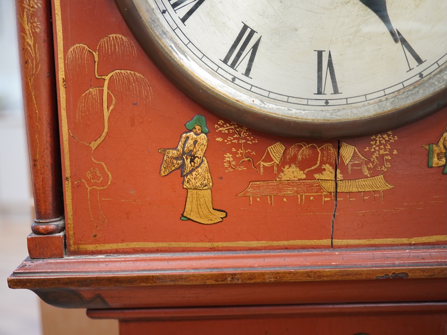 A 1930's Japanned grandmother clock with Roman numeral dial. Condition - poor, cracked and chipped